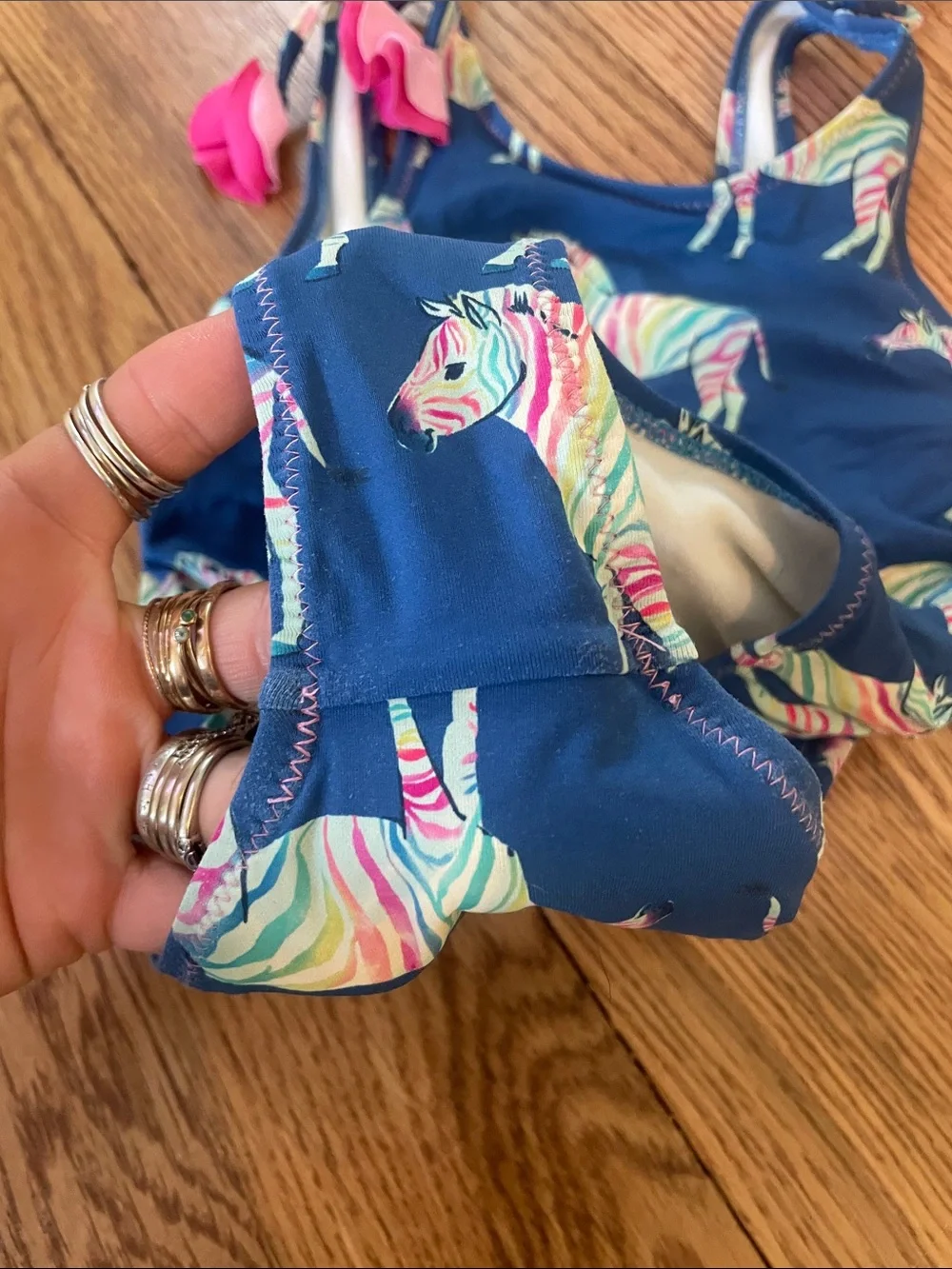 Hatley Navy One-Piece Swimsuit with Multicolor Zebra Print and Pink Tie Accents